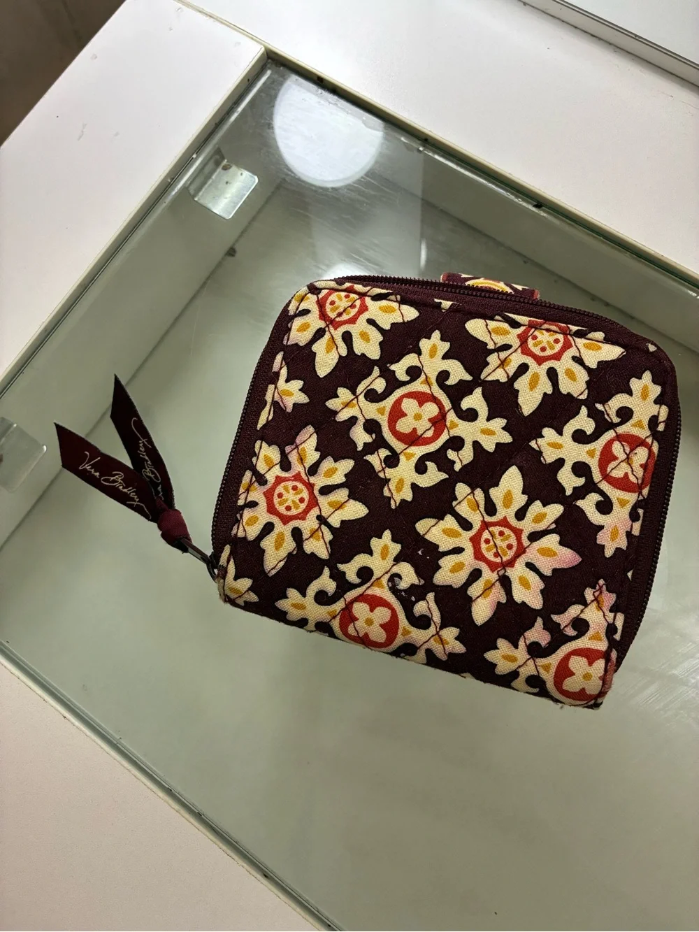 Vera Bradley Bifold Square Zip Wallet Has pink staining on back of wallet shown